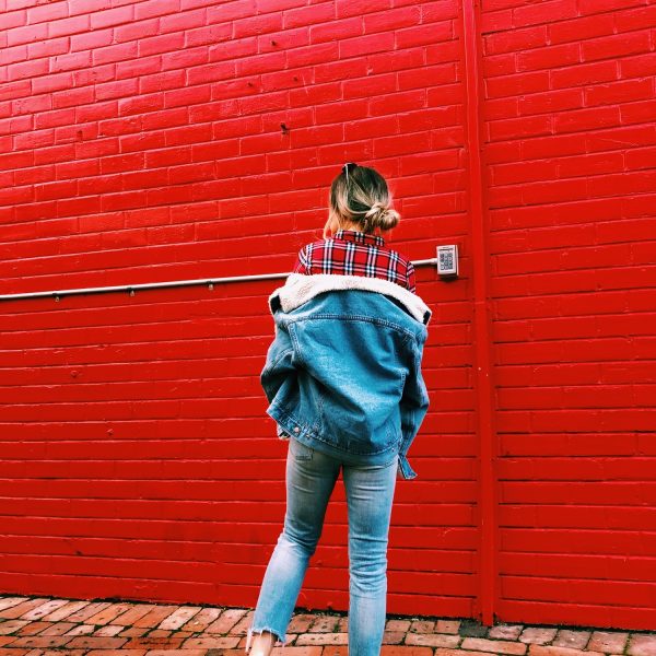 Girl wearing blue denim Sherpa jacket and jeans